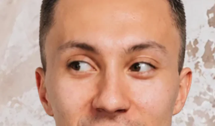 Gaze straight to the left: both irises pressed into the left corners of the eyes, sclera exposed on the right